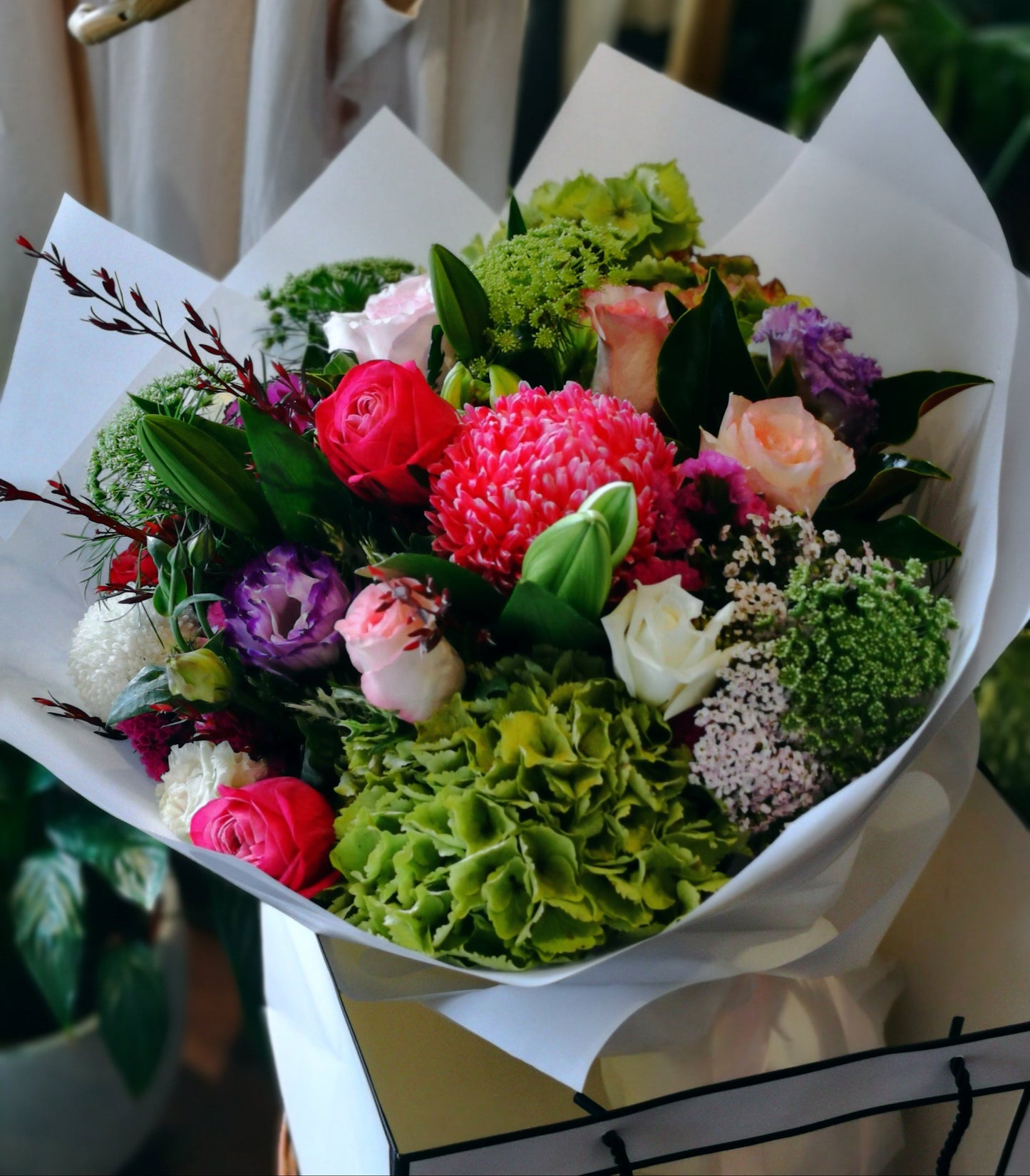 Bouquet of flowers with greenery and colorful flowers