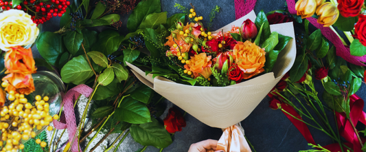 lush and becautiful pastel bouquet with orange and red roses for Mother's Day