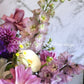 This resplendent selection of blue, mauve and purple flowers artfully arranged into a box arrangement makes an ideal gift for all.