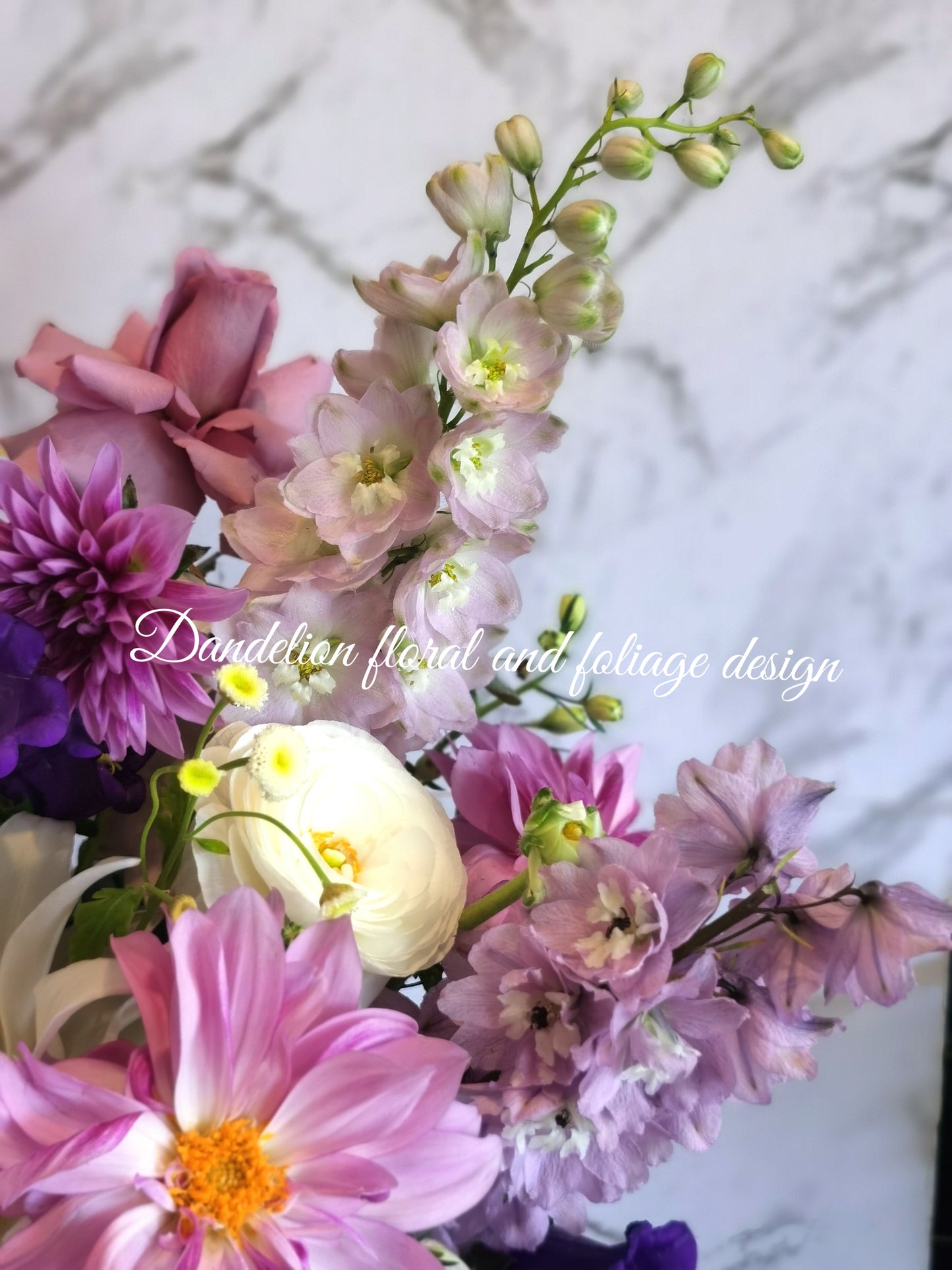 This resplendent selection of blue, mauve and purple flowers artfully arranged into a box arrangement makes an ideal gift for all.