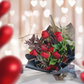 The classic romantic gesture. A dozen of premium long stem red roses complimented with a variety of greenery for added texture and style.