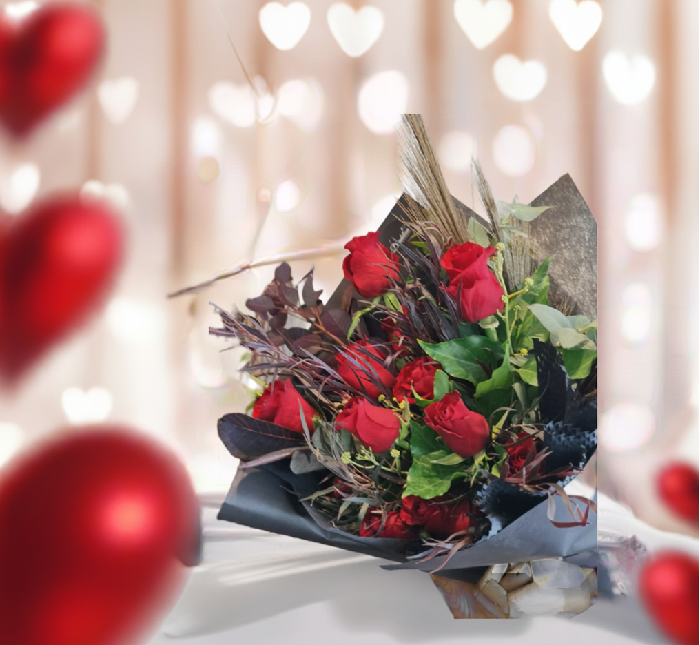 The classic romantic gesture. A dozen of premium long stem red roses complimented with a variety of greenery for added texture and style.