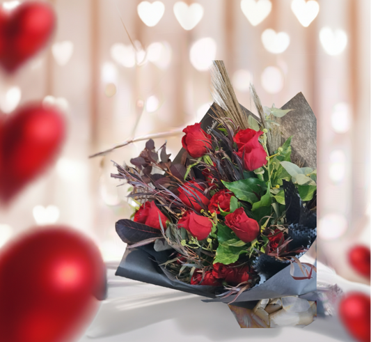 The classic romantic gesture. A dozen of premium long stem red roses complimented with a variety of greenery for added texture and style.