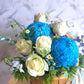 Congratulate new parents or beautify the home with a gorgeous palette of white florals with a touch of blue. For added joy this arrangement includes a fluffy teddy bear. The gift includes seasonal white, blue and green flowers in a basket.
