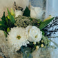The white and green bouquet features fresh and seasonal blooms in shades of white/cream/ivory, greens and neutral colours. It will make an ideal gift to express your love, gratitude or congratulation.