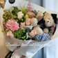 A graduation bouquet featuring a mix of pastel colored flowers and greenery, wrapped with a ribbon, alongside a plush toy bear. Lush bouquet using seasonal blooms in pastel tones complimented with seasonal greenery.
Our Graduation Flowers are the perfect way to send your best wishes and honour their hard work and dedication. With an added special touch our graduation bear - the perfect keepsake.