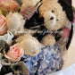 A graduation bouquet featuring a mix of pastel colored flowers and greenery, wrapped with a ribbon, alongside a plush toy bear. Lush bouquet using seasonal blooms in pastel tones complimented with seasonal greenery.
Our Graduation Flowers are the perfect way to send your best wishes and honour their hard work and dedication. With an added special touch our graduation bear - the perfect keepsake.
