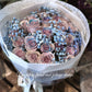 A bouquet of mauve color roses with a shining texture, held by a mannequin. The bouquet features a mix of large and small roses, and is complemented by blue accents in the form of flower beads. 36 stems of&nbsp;premium 40cm mauve colour roses with Shining texture.
Whether impressing a new love, proposing to someone or simply to say "I love you", this&nbsp;special bouquet will take their breath away.
Available in 36 stems(classic), 48 stems(Large) and 60 stems(Deluxe)