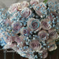 A bouquet of mauve color roses with a shining texture, held by a mannequin. The bouquet features a mix of large and small roses, and is complemented by blue accents in the form of flower beads. 36 stems of&nbsp;premium 40cm mauve colour roses with Shining texture.
Whether impressing a new love, proposing to someone or simply to say "I love you", this&nbsp;special bouquet will take their breath away.
Available in 36 stems(classic), 48 stems(Large) and 60 stems(Deluxe)