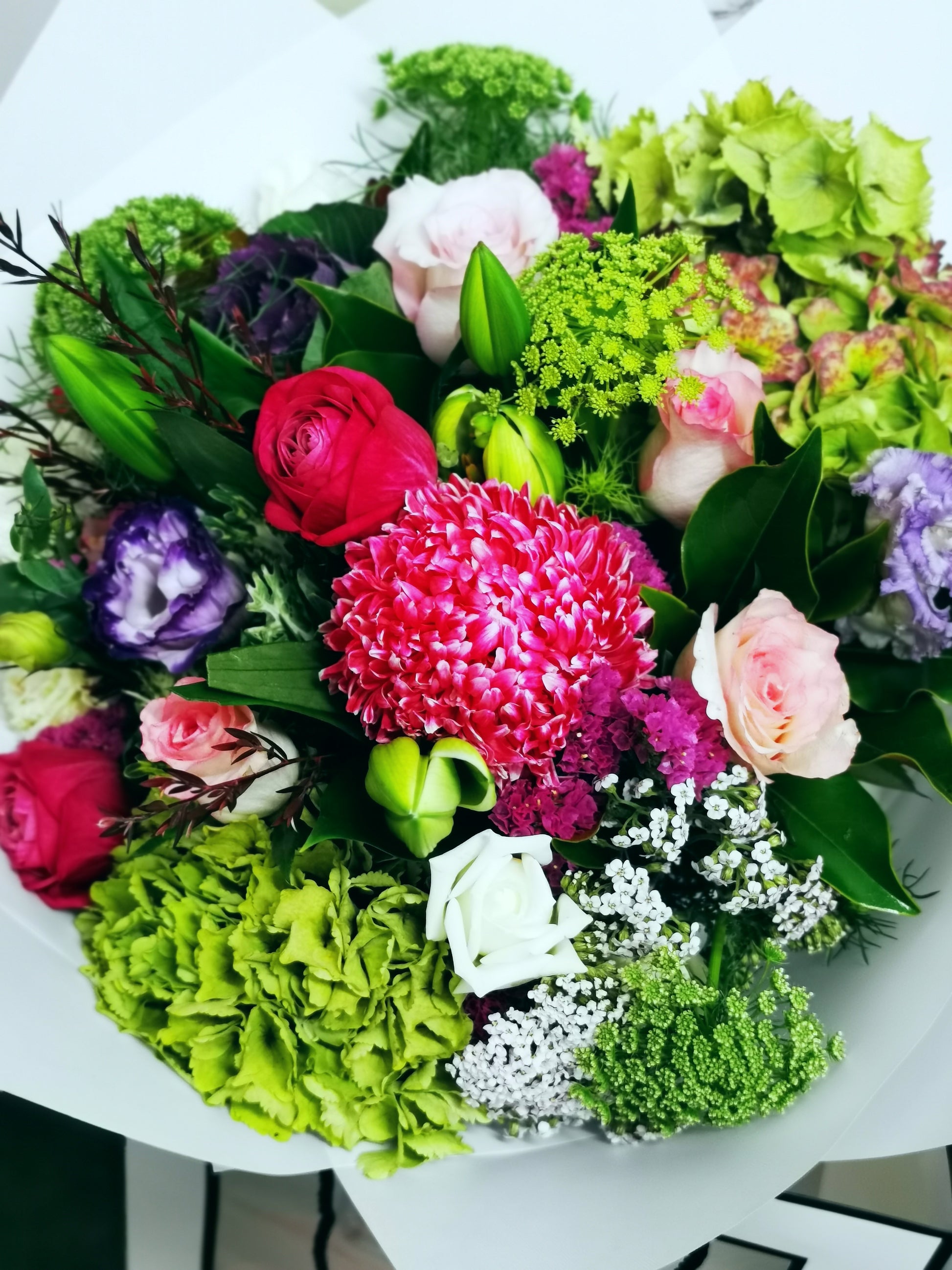 Bouquet of flowers with greenery and colorful flowers