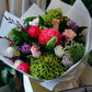 Bouquet of flowers with greenery and colorful flowers