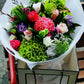 Bouquet of flowers with greenery and colorful flowers