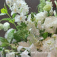 Lush stands tall filled with white Oriental Lilies, Lisianthus, Gladioli and Viburnum leaves. It is 1100mm tall, 500mm wide.