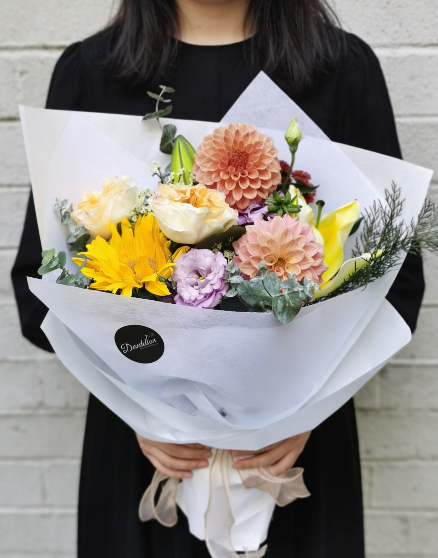 cozy, autumnal blend of sun-kissed sunflowers, velvety dahlias, and soft lavender accents