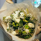 This gorgeous flower bouquet have oriental lilies disbud mums, lisianthus, roses and snapdragons and etc. These stunning blooms are highlighted by a range of foliage like wax, gum and dusty miller. These winter flowers are ideal for any occasions. Available with pastel, white and orange colours.