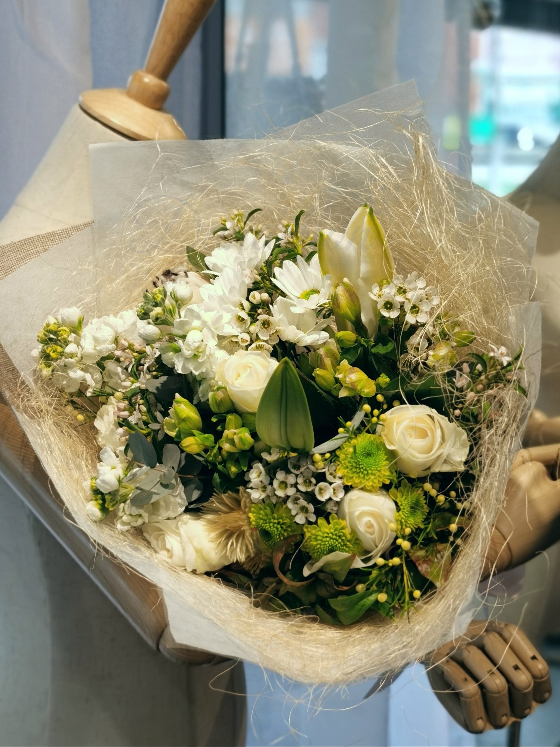 This gorgeous flower bouquet have oriental lilies disbud mums, lisianthus, roses and snapdragons and etc. These stunning blooms are highlighted by a range of foliage like wax, gum and dusty miller. These winter flowers are ideal for any occasions. Available with pastel, white and orange colours.