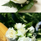 White wrist corsage and buttonhole bundle for weddings and formal events