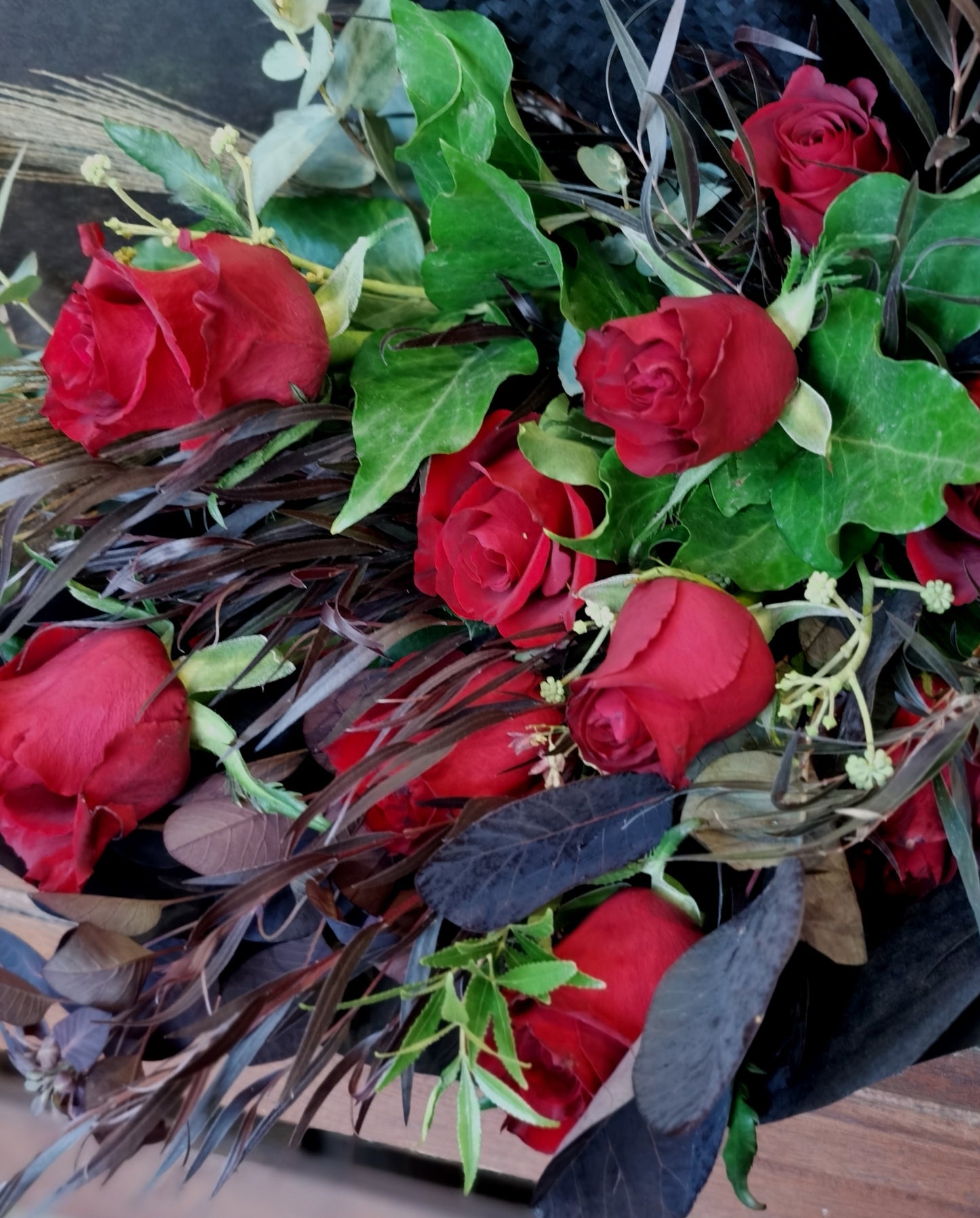The classic romantic gesture. A dozen of premium long stem red roses complimented with a variety of greenery for added texture and style.