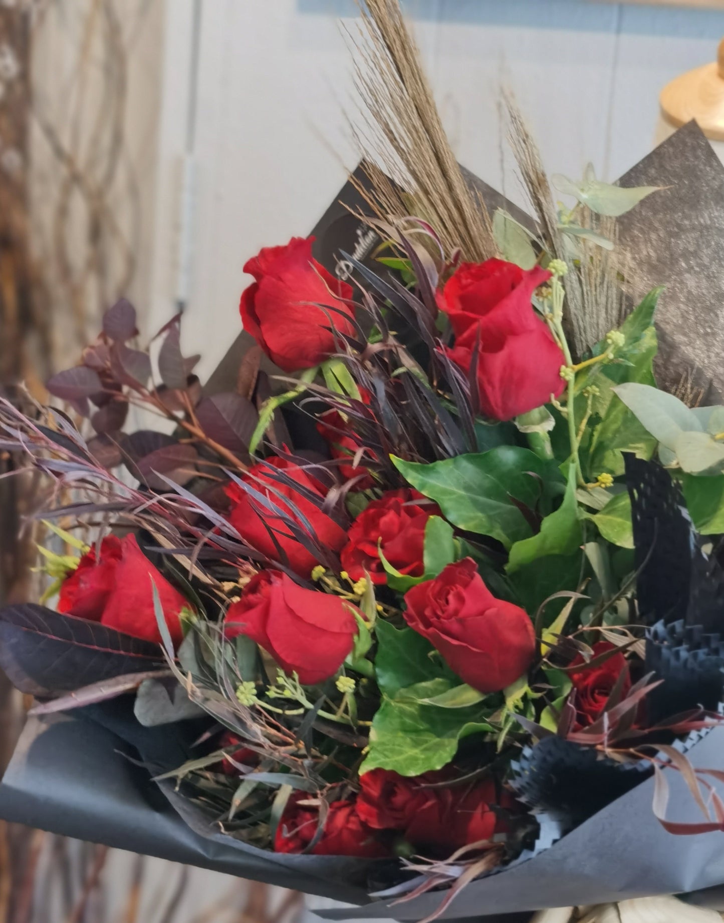 The classic romantic gesture. A dozen of premium long stem red roses complimented with a variety of greenery for added texture and style.