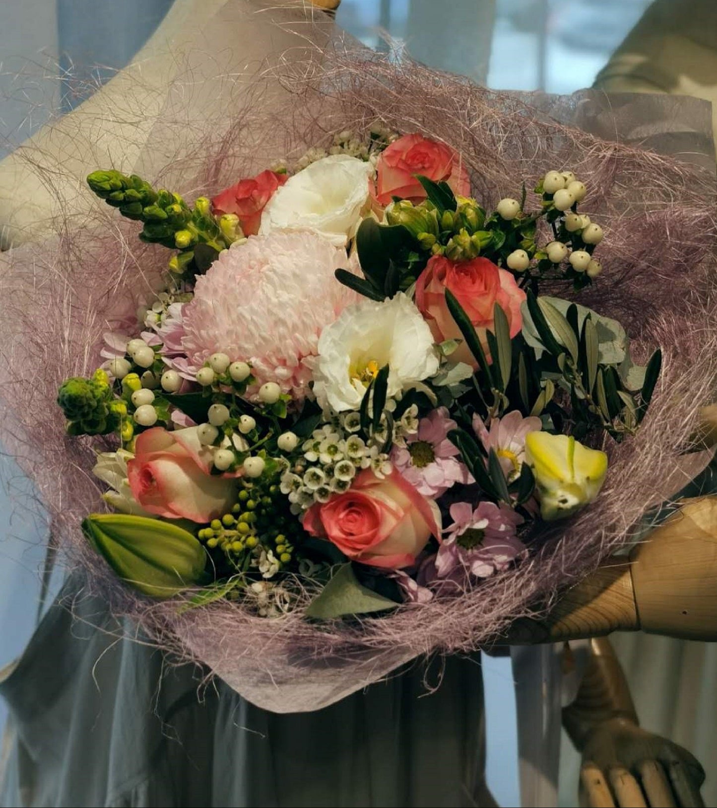 This gorgeous flower bouquet have oriental lilies disbud mums, lisianthus, roses and snapdragons and etc. These stunning blooms are highlighted by a range of foliage like wax, gum and dusty miller. These winter flowers are ideal for any occasions. Available with pastel, white and orange colours.